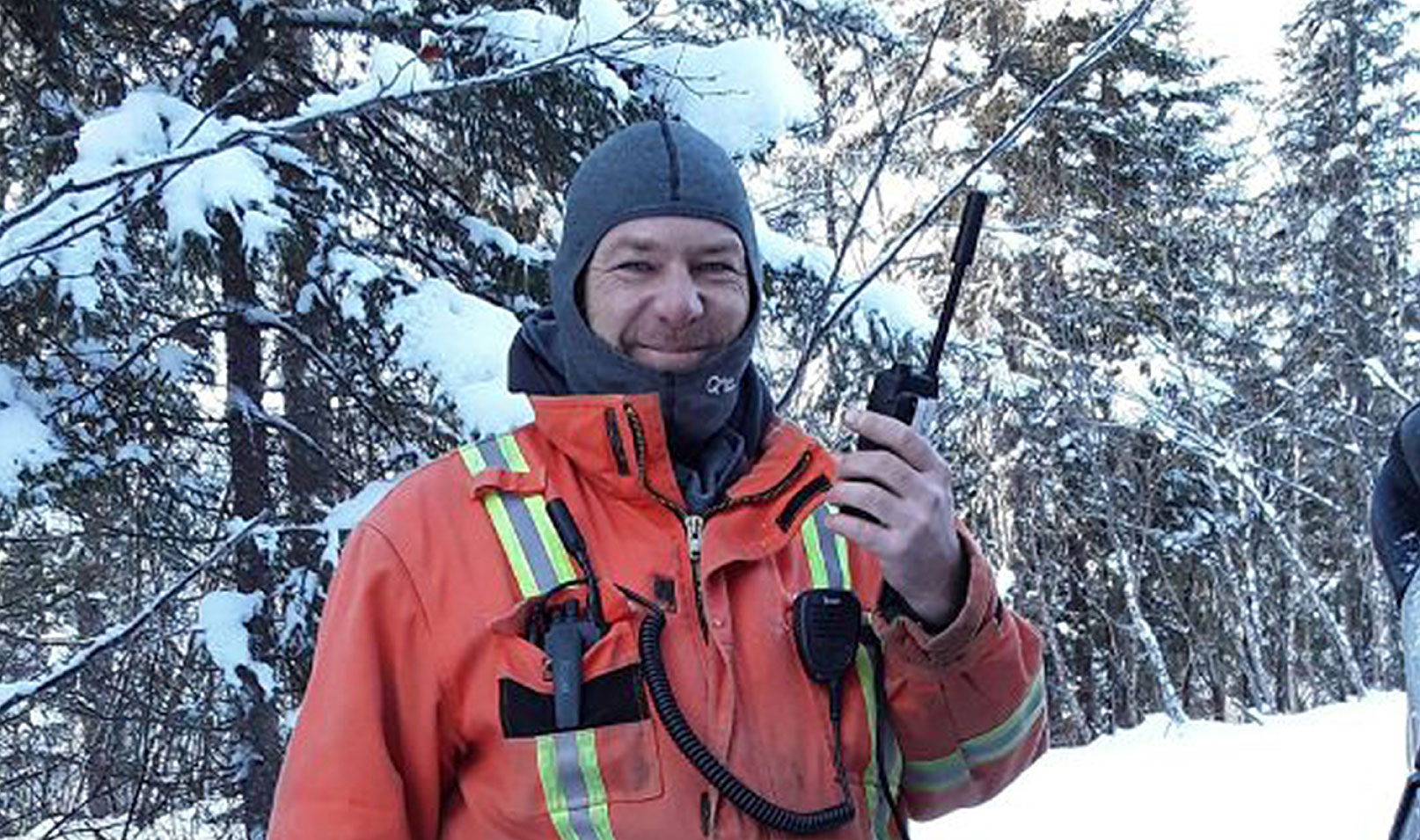 Remote utility worker from Hydro Québec uses an Iridium PTT radio to stay connected during utility line construction